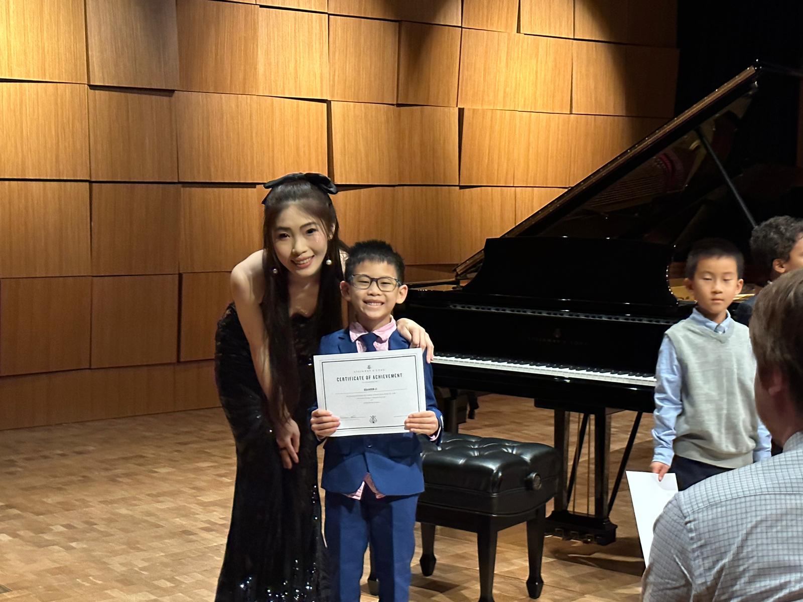 Cristina with student receiving certificate