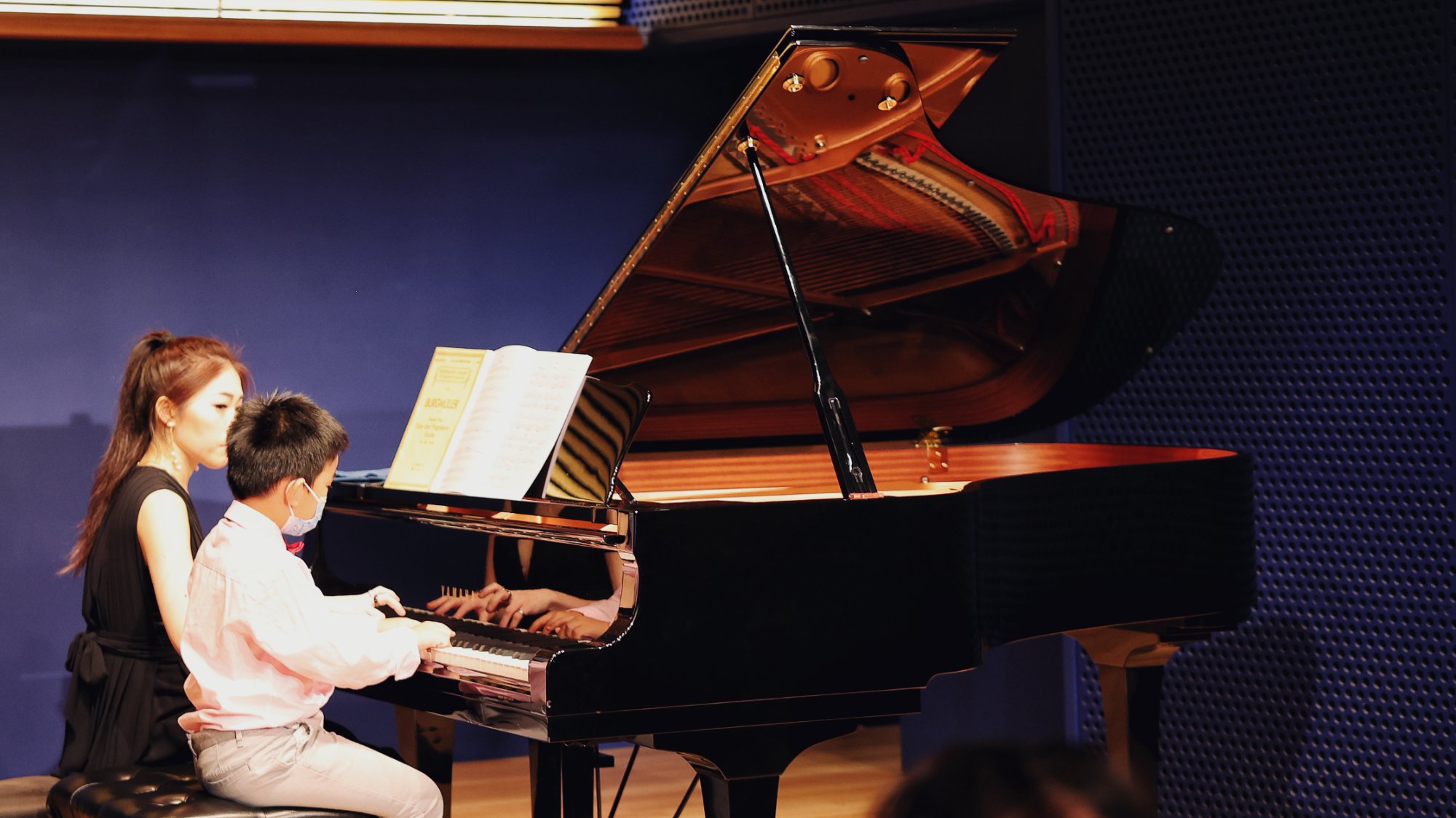Cristina teaching a piano lesson