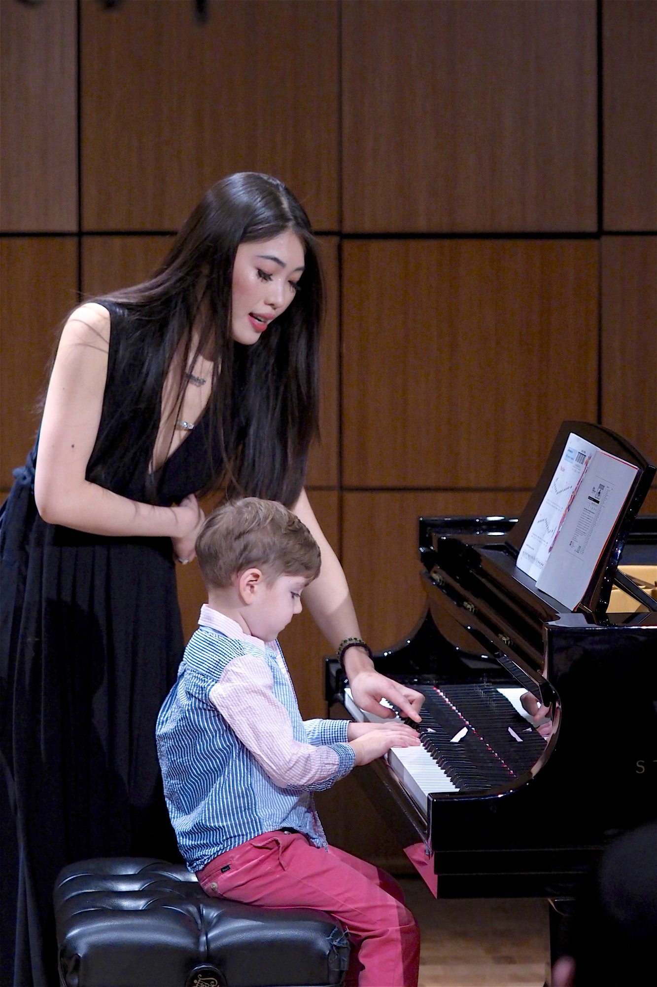 Cristina teaching a young student at the Steinway grand piano