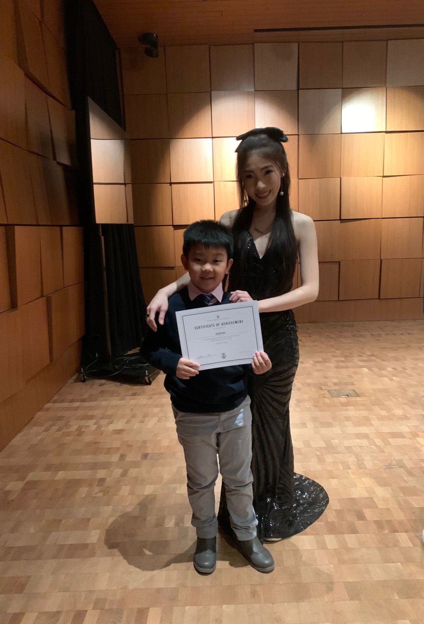 Student performing at grand piano recital 2023